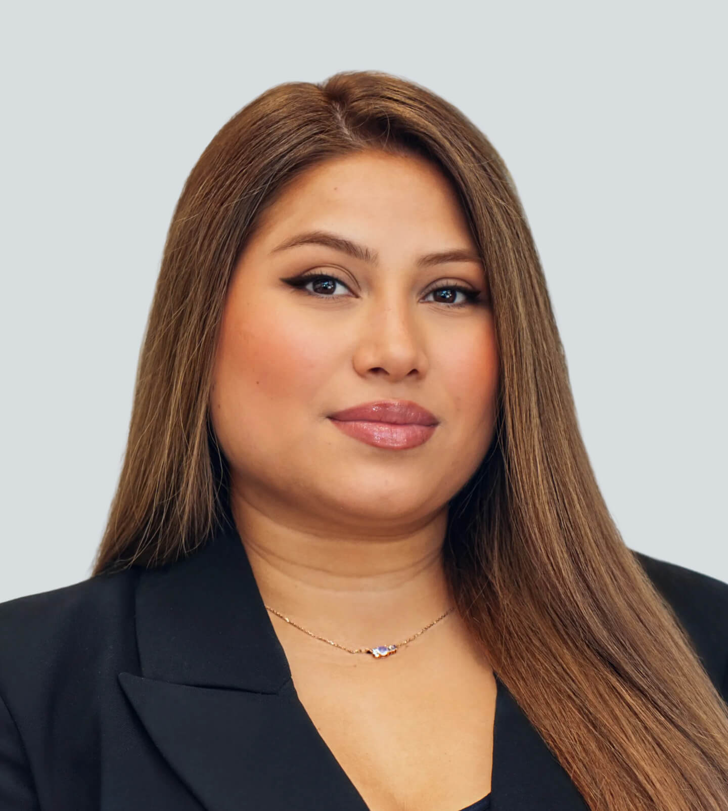 A headshot of Xiomara Escobar from X Beauty Studio on a white background.