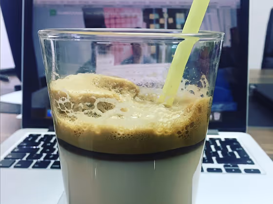 cocktail in front of macbook