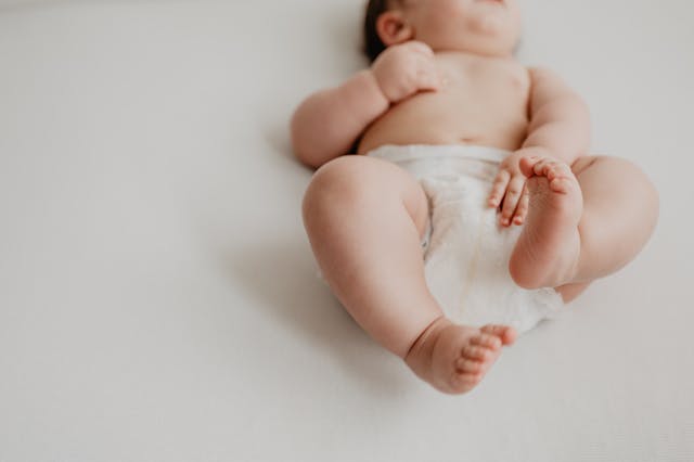 Baby laying on its back in a diaper Blueberry Pediatrics Affordable online pediatrician telemedicine USA
