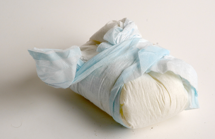 A wrapped soiled baby diaper