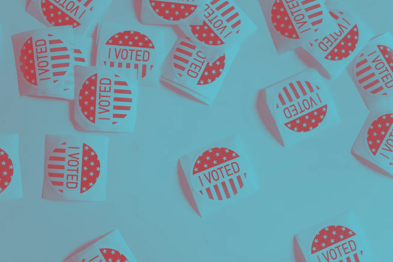 "I voted" stickers scattered on a table