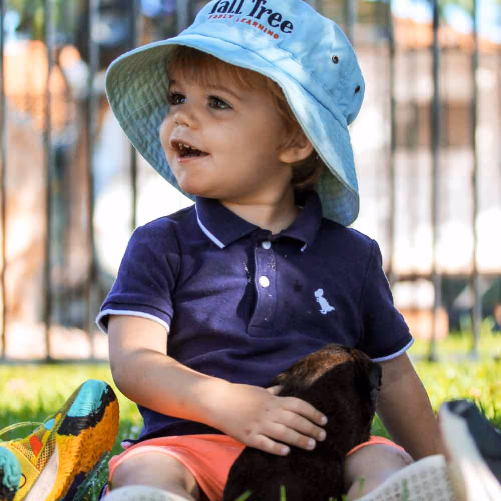 Happy child playing with rabbit