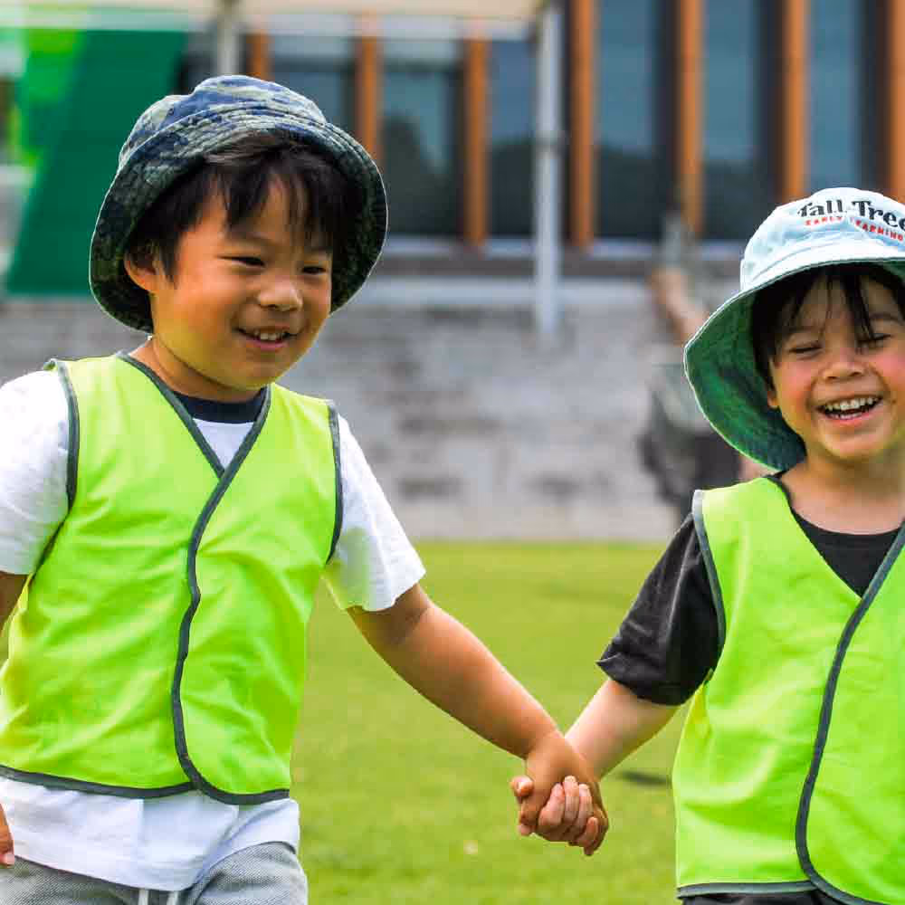 Children at Tall Tree Manning Outside School Care playing in field