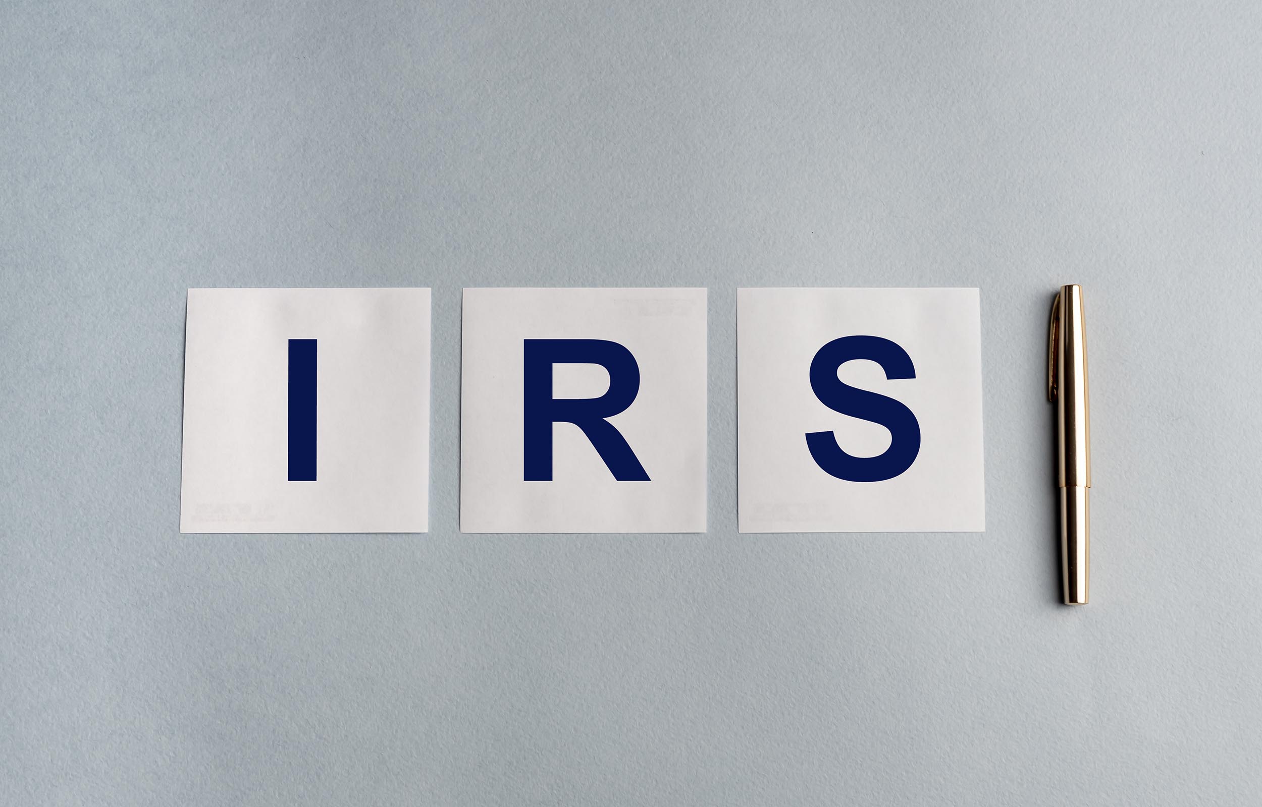 Torn IRS letter pieces, representing tax resolution marketing opportunities
