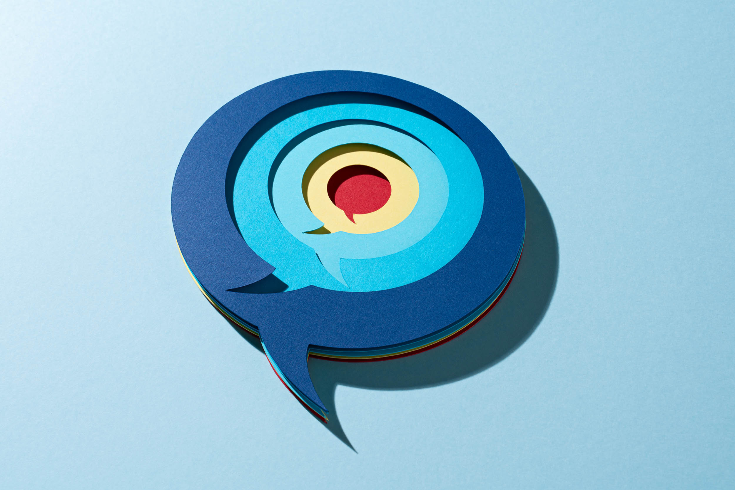 Multi-layered chat bubbles representing online reviews and conversations