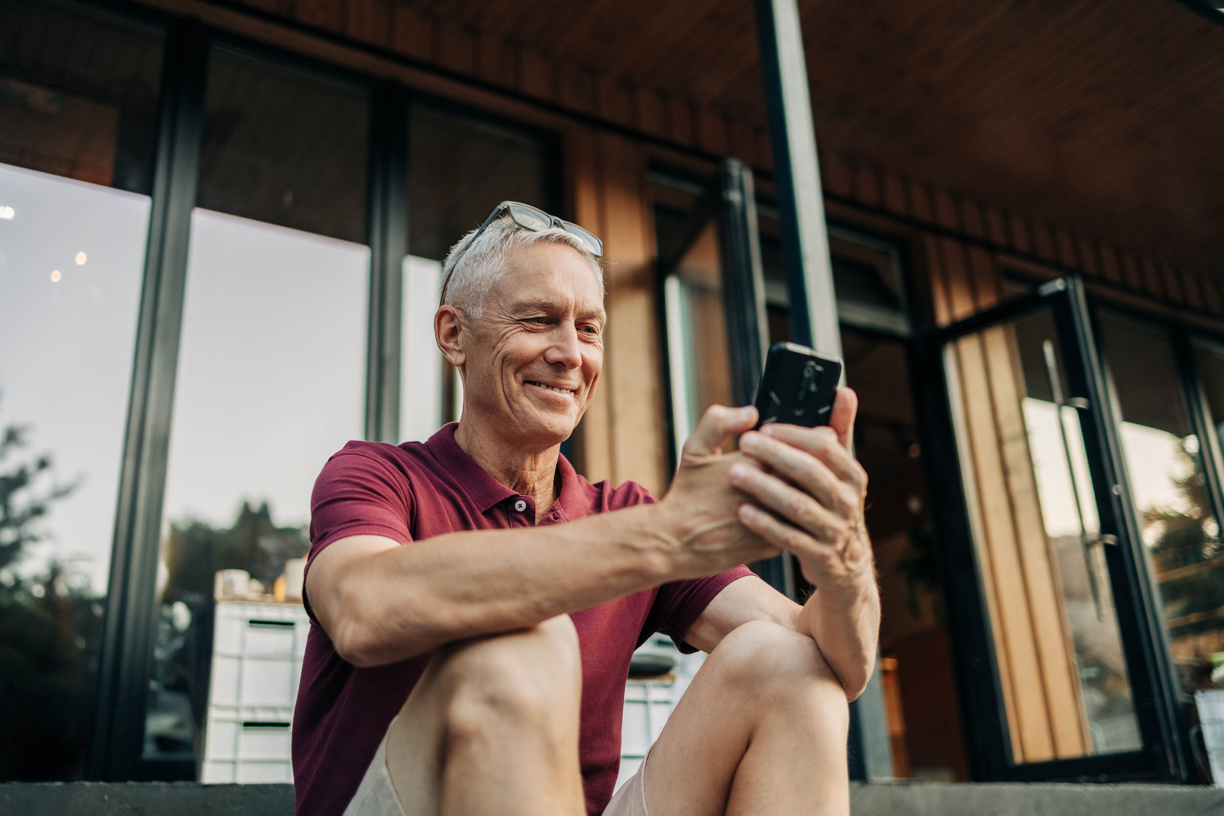 Man using a mobile device to search for information, representing AI-driven search for accounting firms