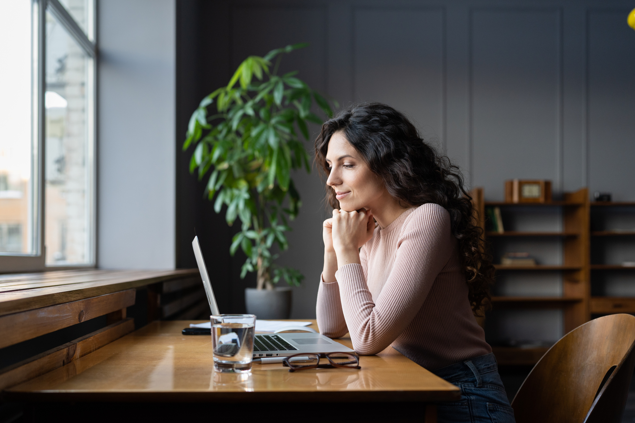 Accountant reviewing an AI-drafted email response to a client