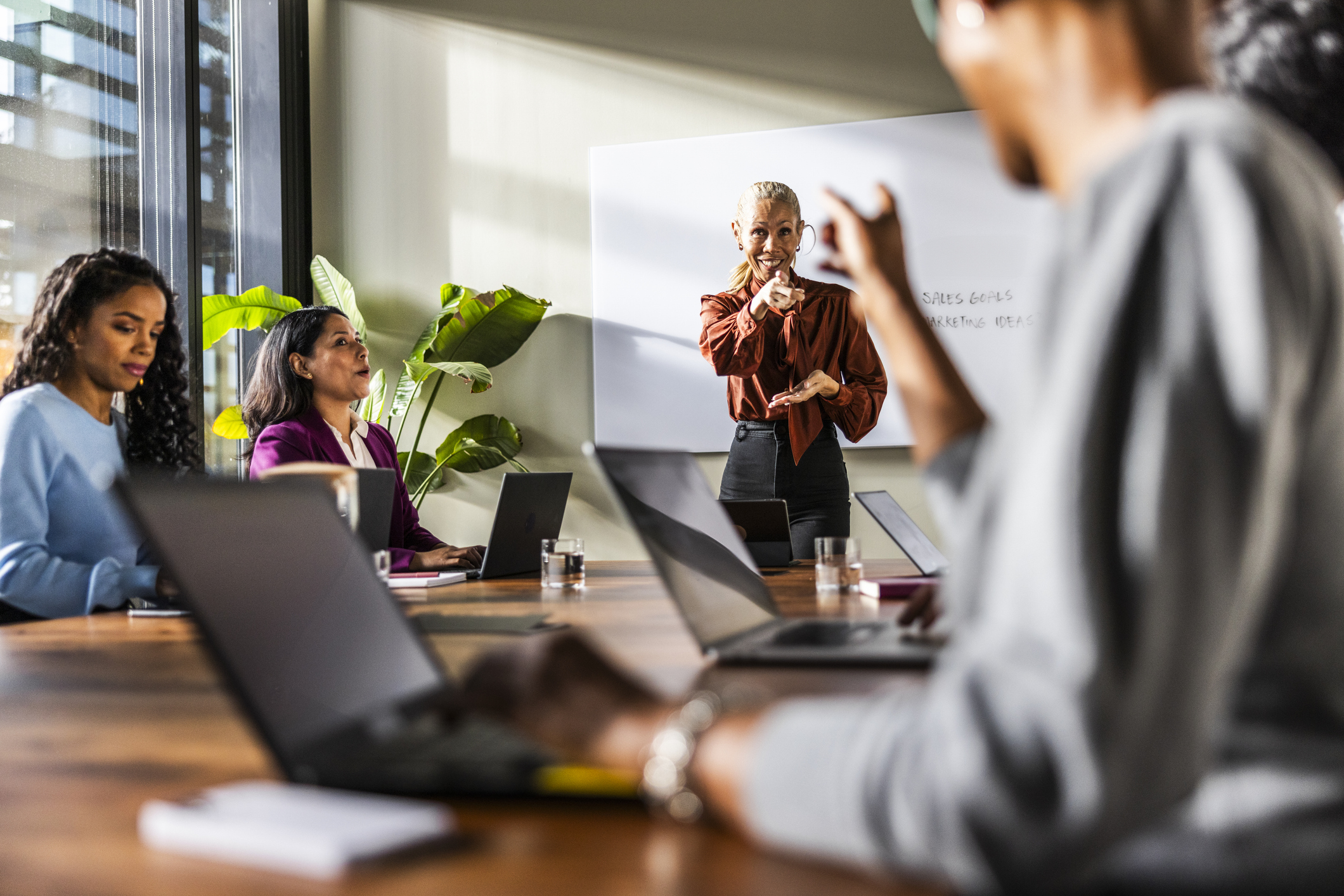 Team collaborating, representing a small firm operating like a larger one