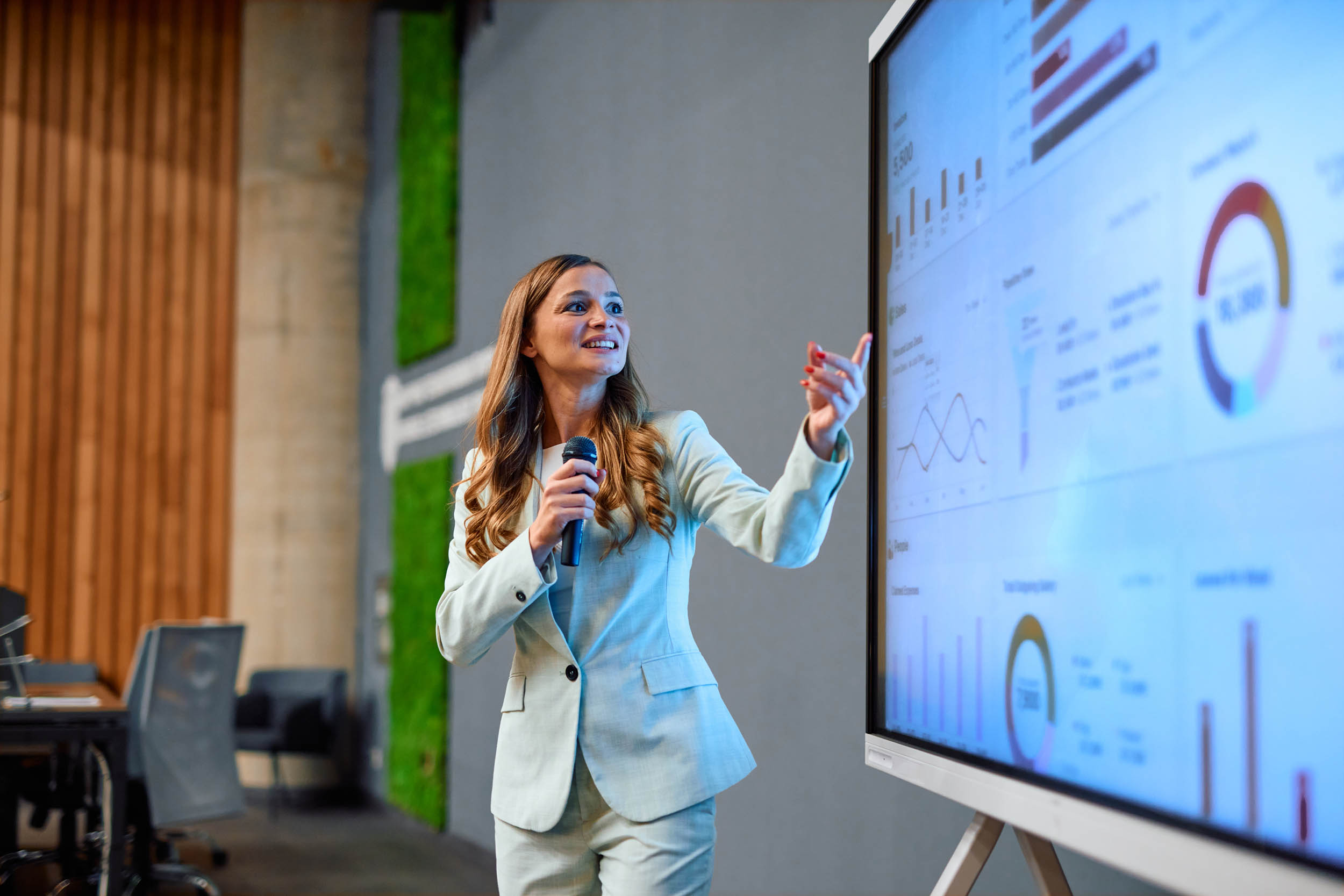 Financial analyst presenting at a business meeting