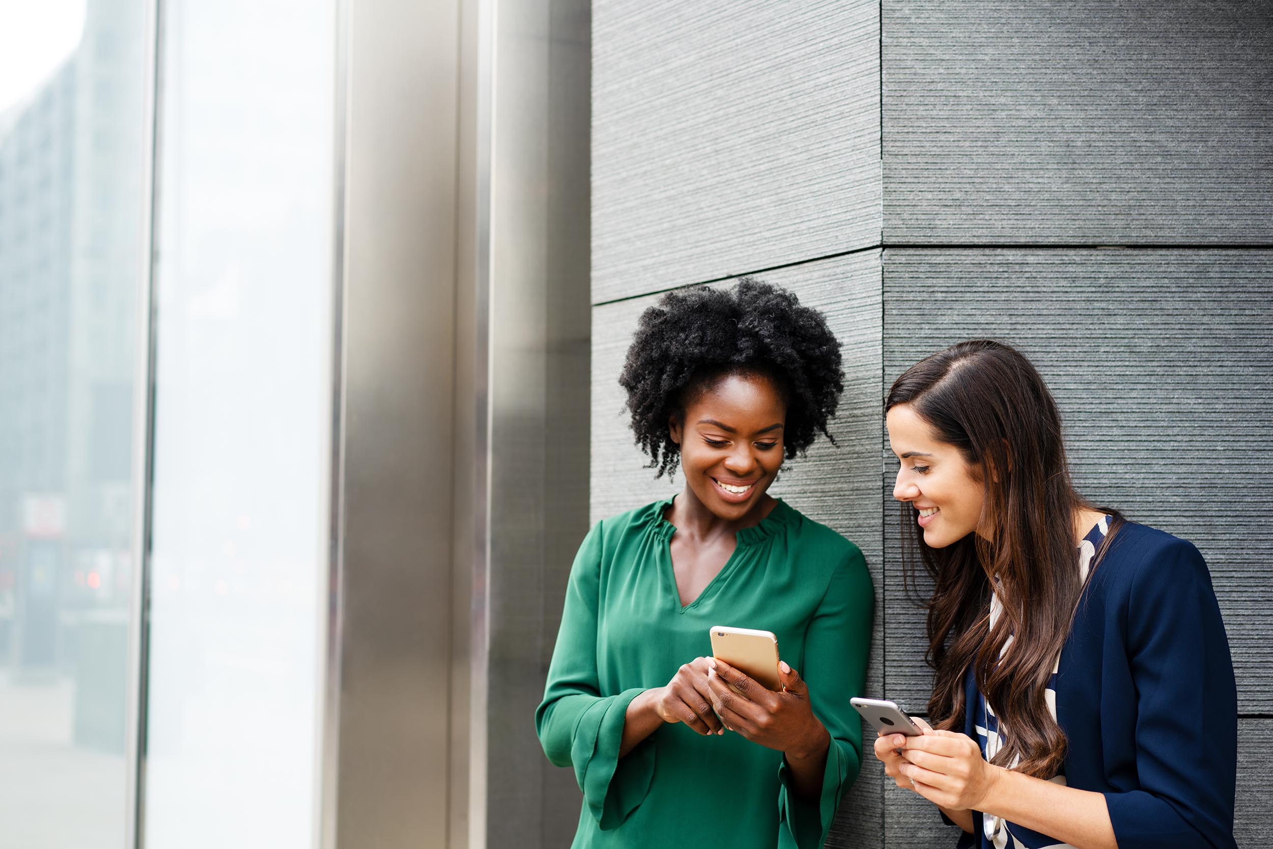 Person sharing a recommendation with a friend, representing referral-driven growth