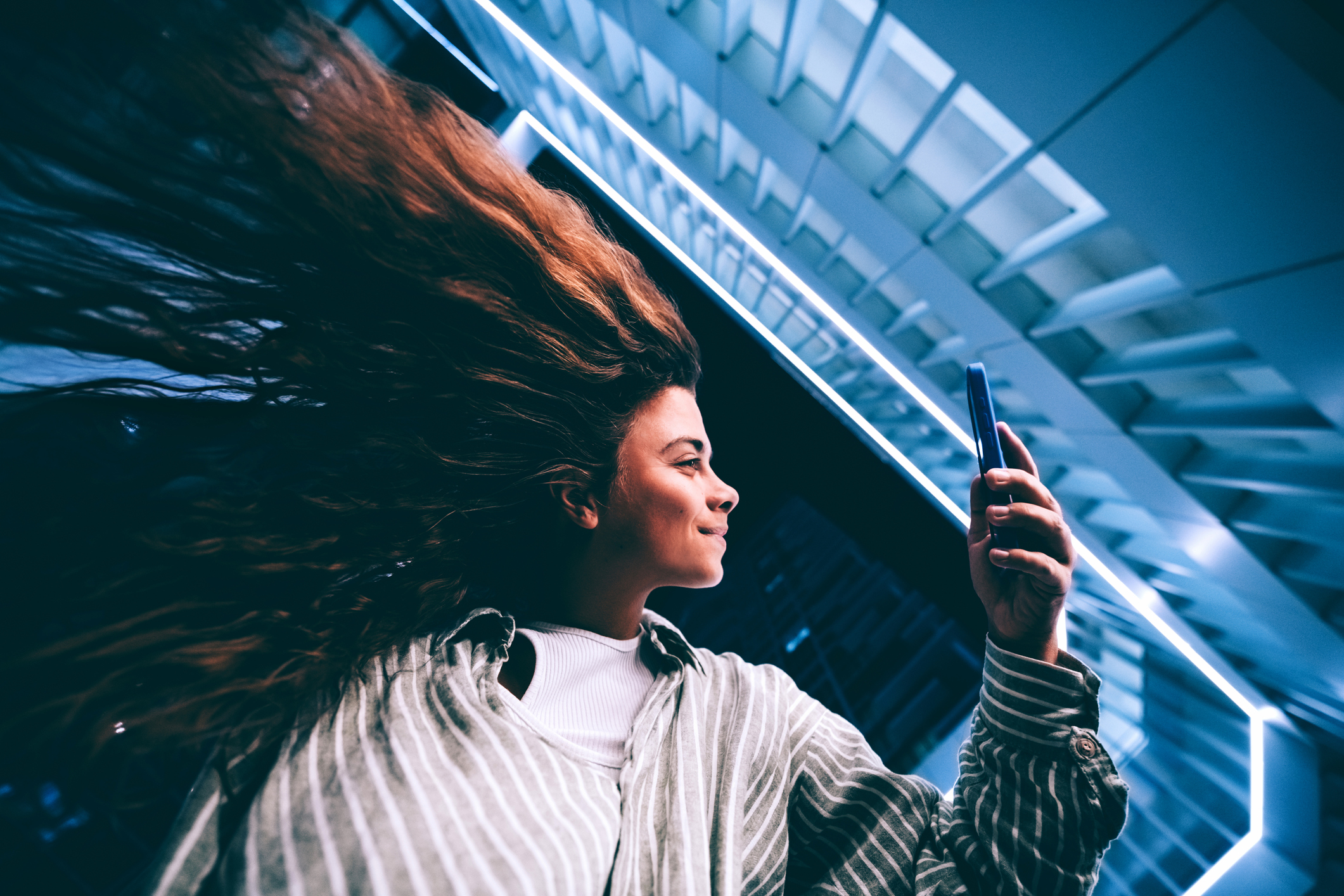 Person using AI on a phone, representing structured AI prompting