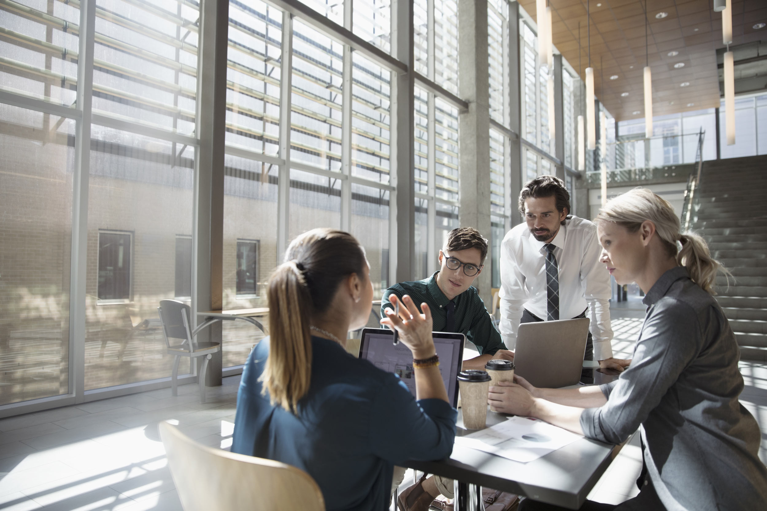 Business discussion, representing the urgency of building AI search visibility before tax season