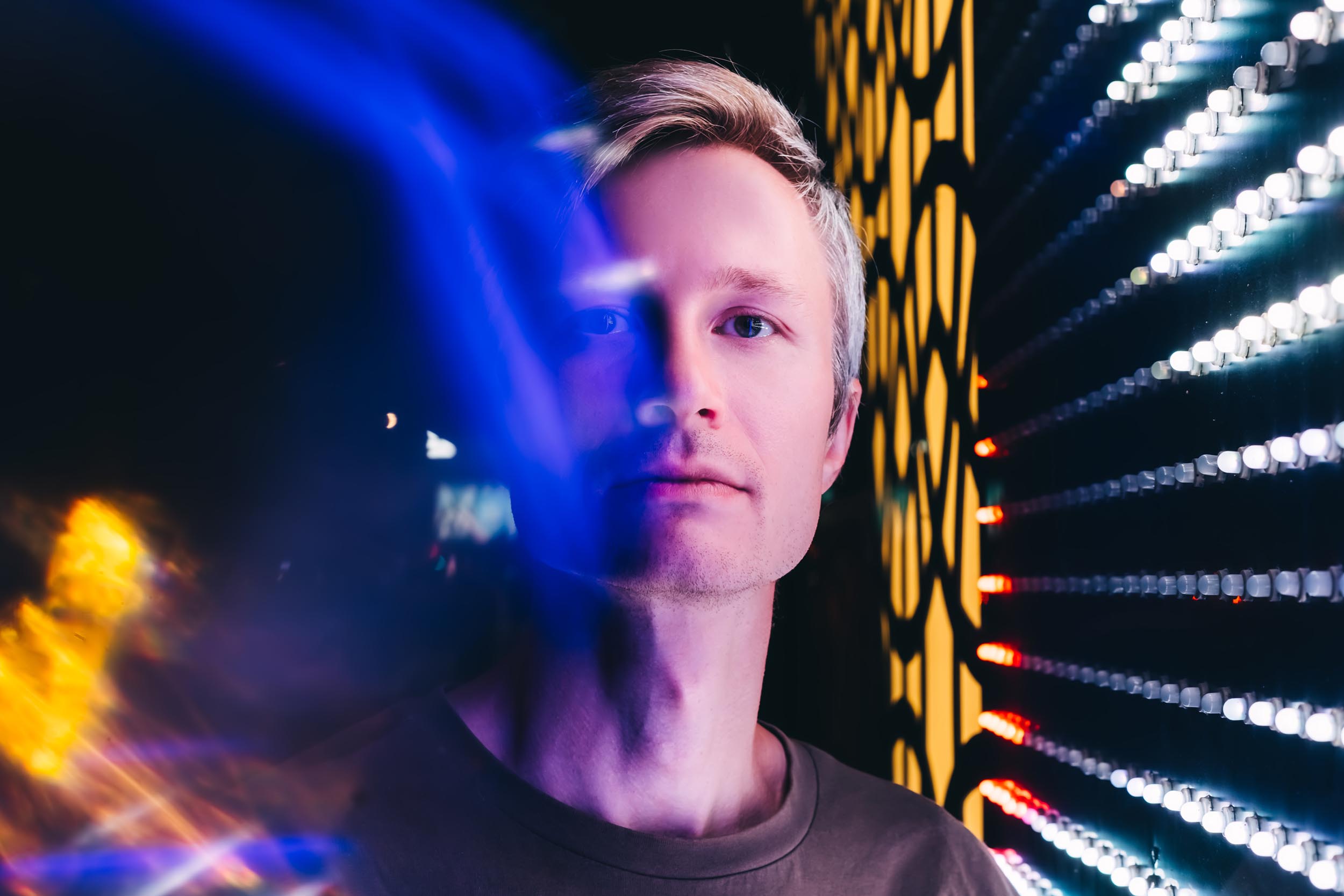 Young man in neon light, representing automation reshaping the accounting profession