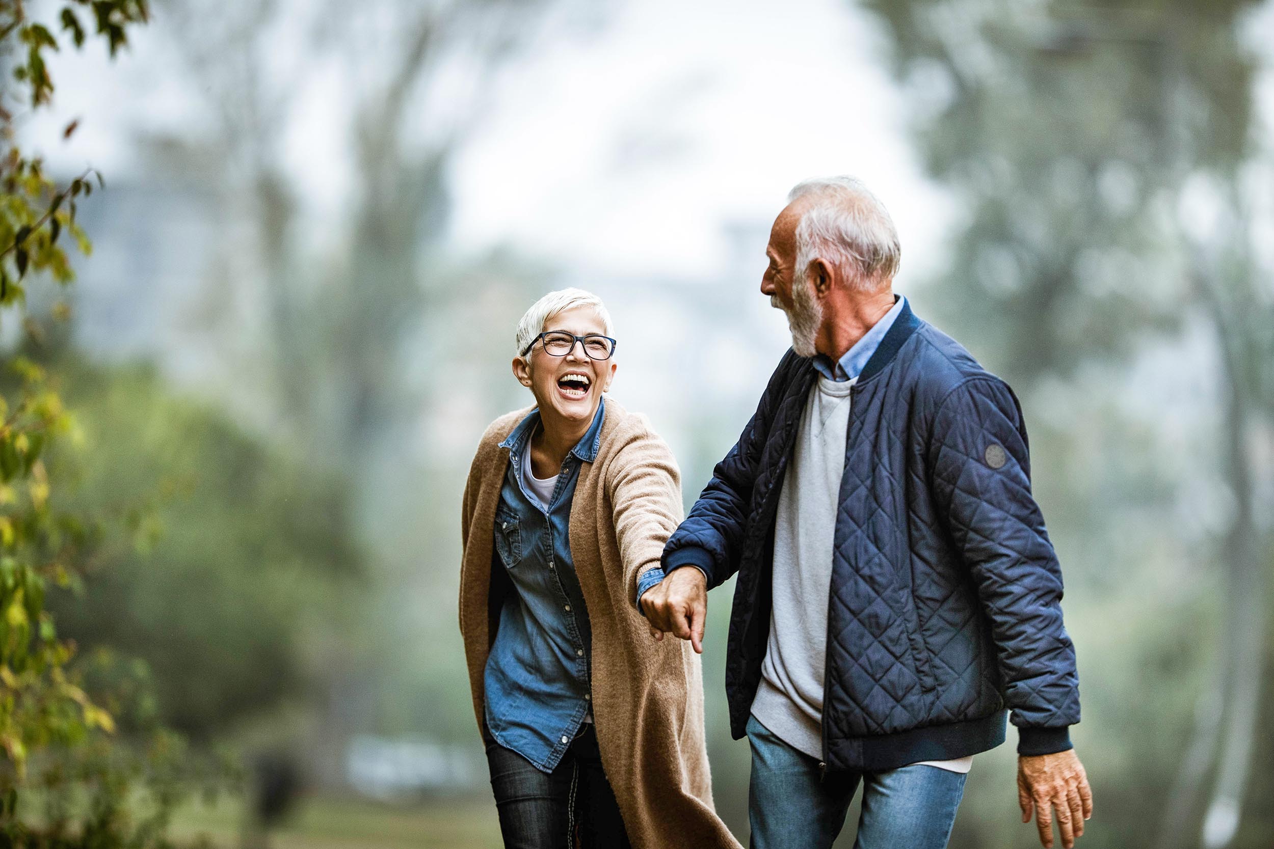 Senior couple taking a stroll, representing advisory relationships with aging clients