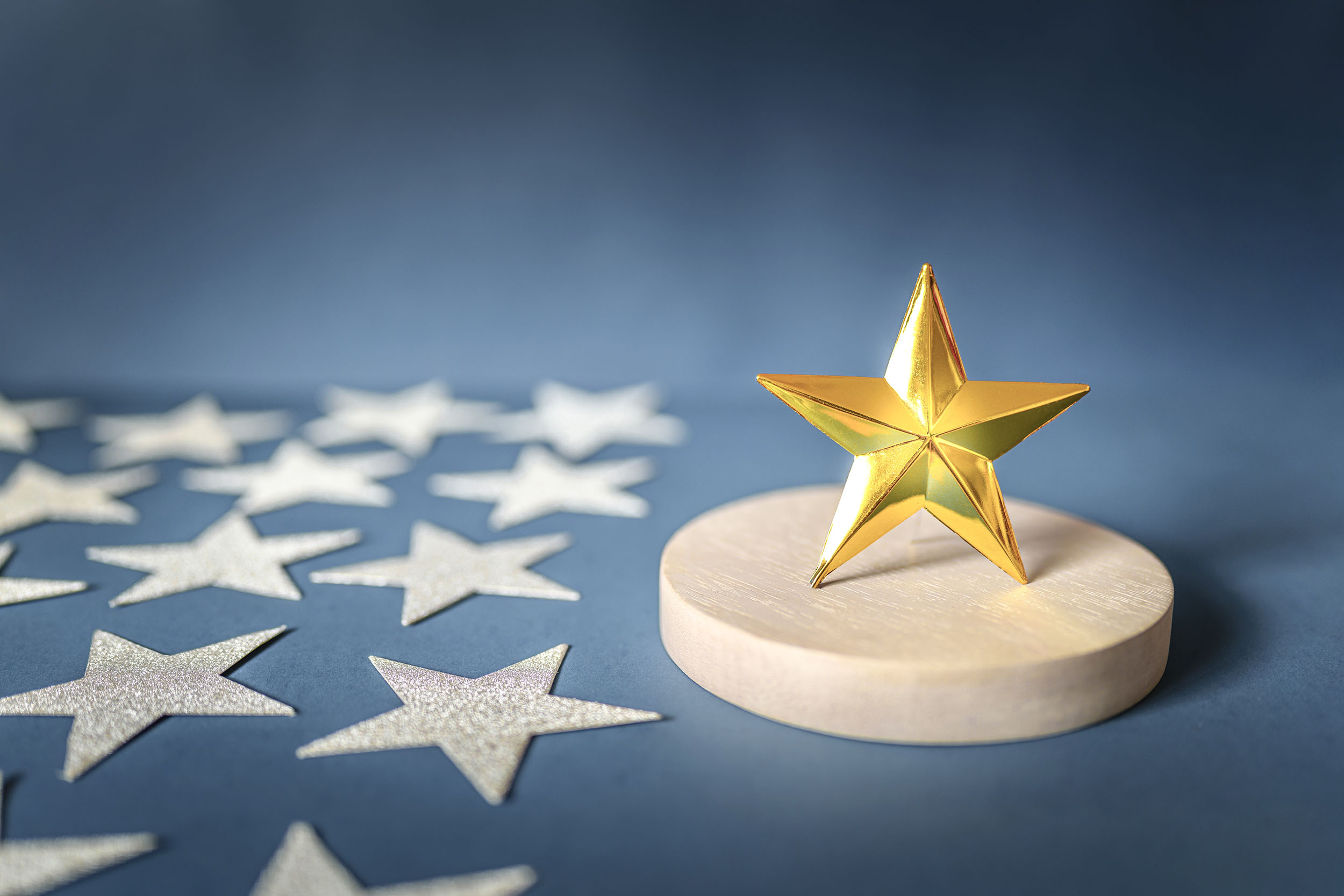 Gold star on a pedestal, representing an automated referral growth engine