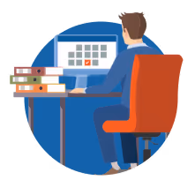 a man sitting at a desk looking at a computer screen