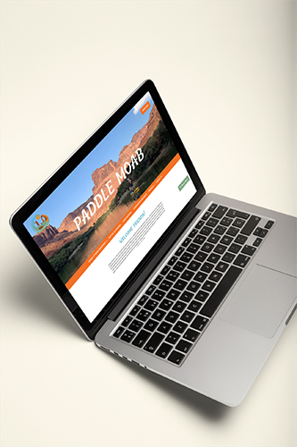 laptop mockup with paddle moabs website on the screen
