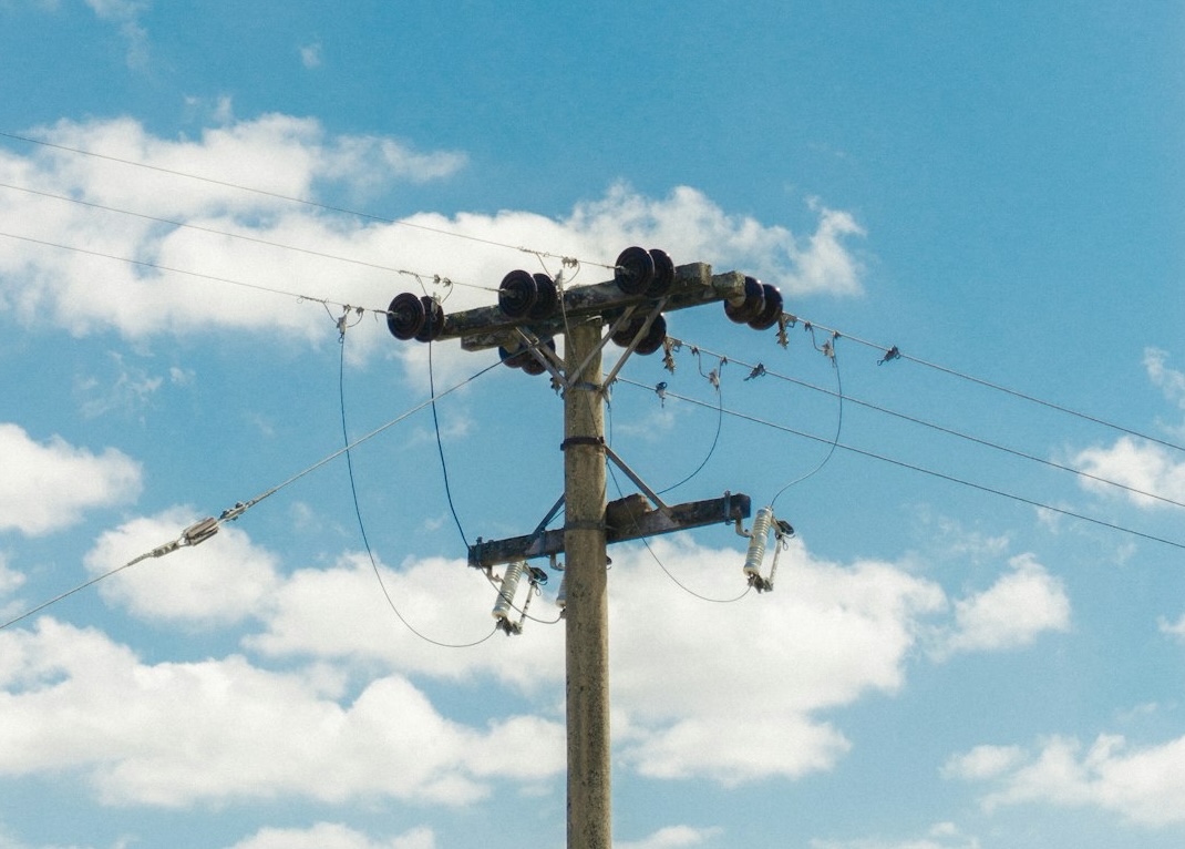 A Temporary Power Pole with a clear blue sky behind it. 