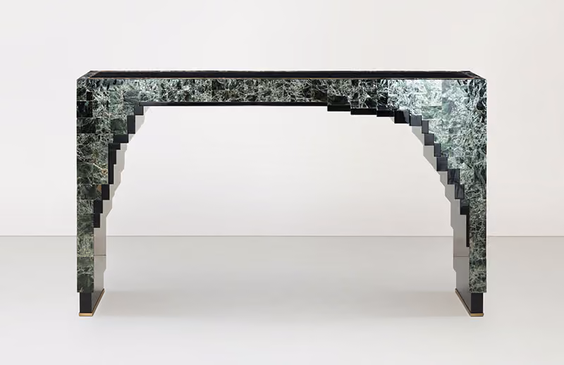 Tall and narrow console table encased in square tiles with a emerald green and black marbled design.