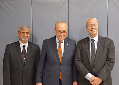 Sen. Schumer stands with UAlbany Vice President for Research Satyendra Kumar (left) and NYS Mesonet Director Chris Thorncroft. (Photo courtesy of Sen. Schumer’s office)