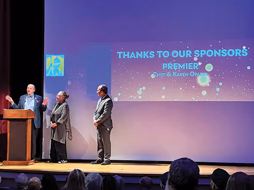 Philanthropists Chet and Karen Opalka address the audience after their $1 million gift to the Writers Institute was announced by President Rodríguez. (Photo: Paul A. Miller, MA ’21)