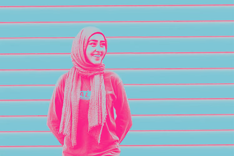 A bright pink and blue filtered photo of Zahra Hashimee