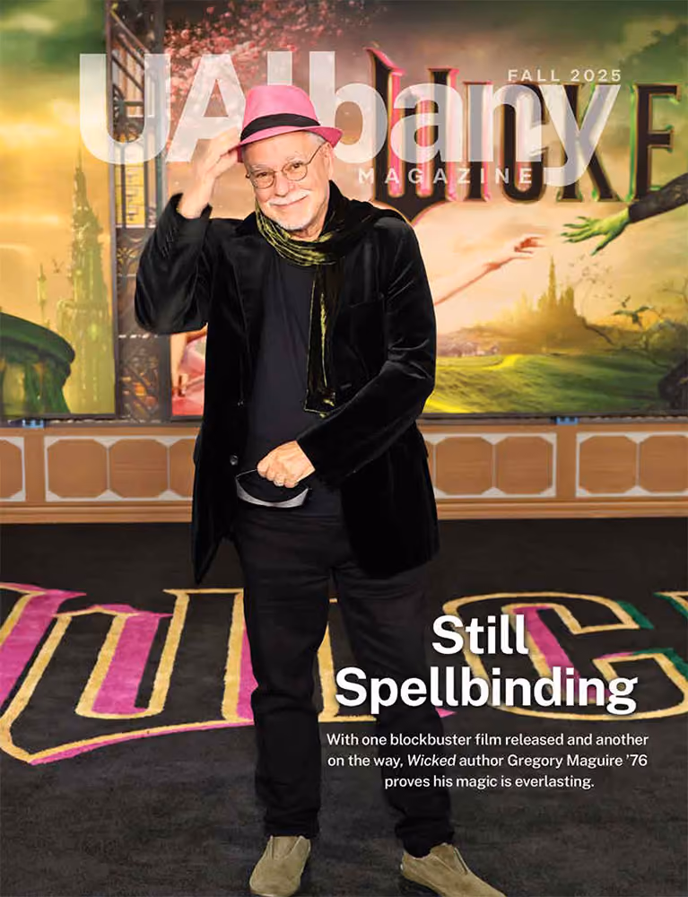 Fall 2025 UAlbany Magazine cover with Gregory Maguire at the premier of Wicked and the headline Still Spellbinding.