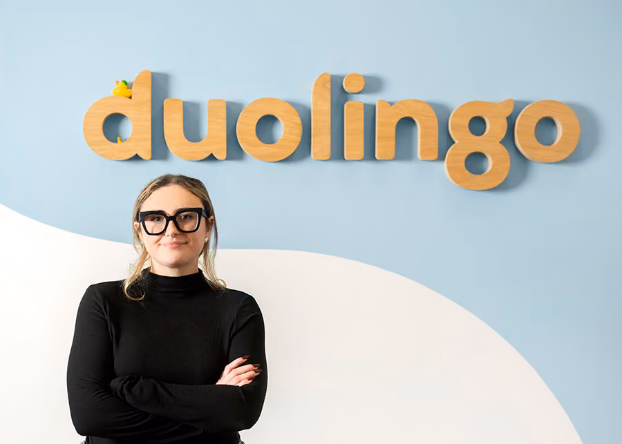 Adele Touhey stands in the Duolingo office space.