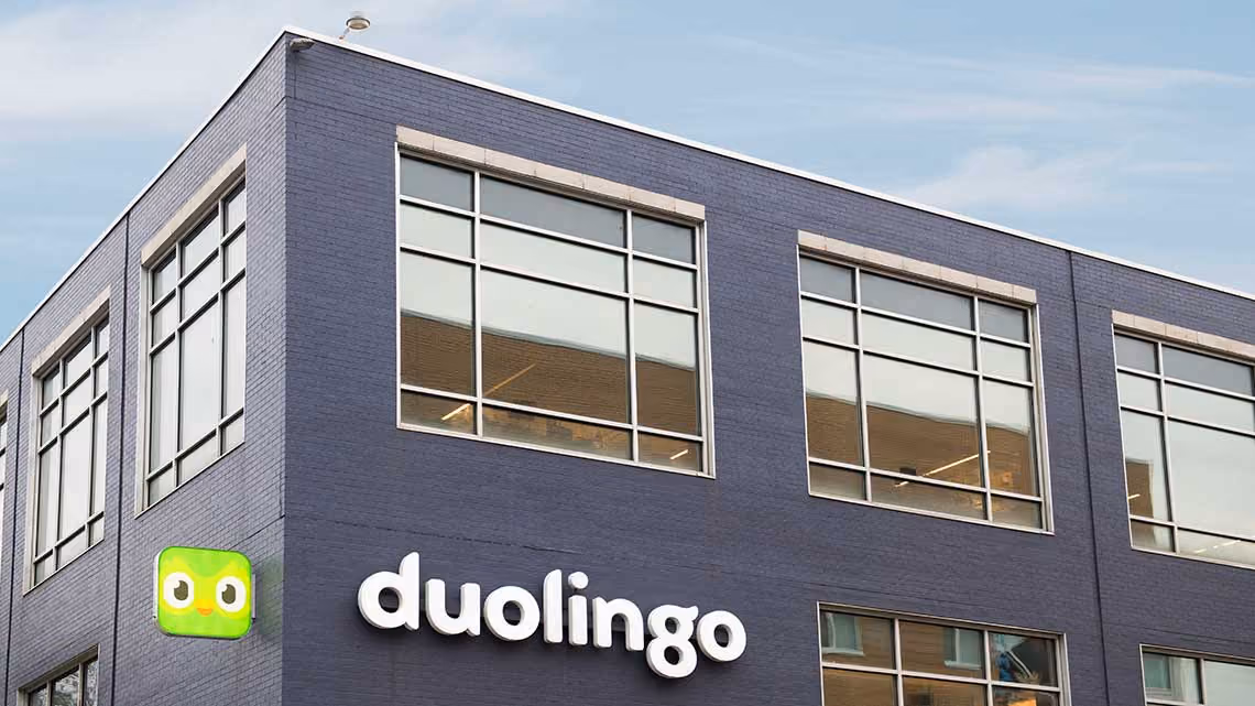 An outside view of the Duolingo office with a prominent company name and logo.