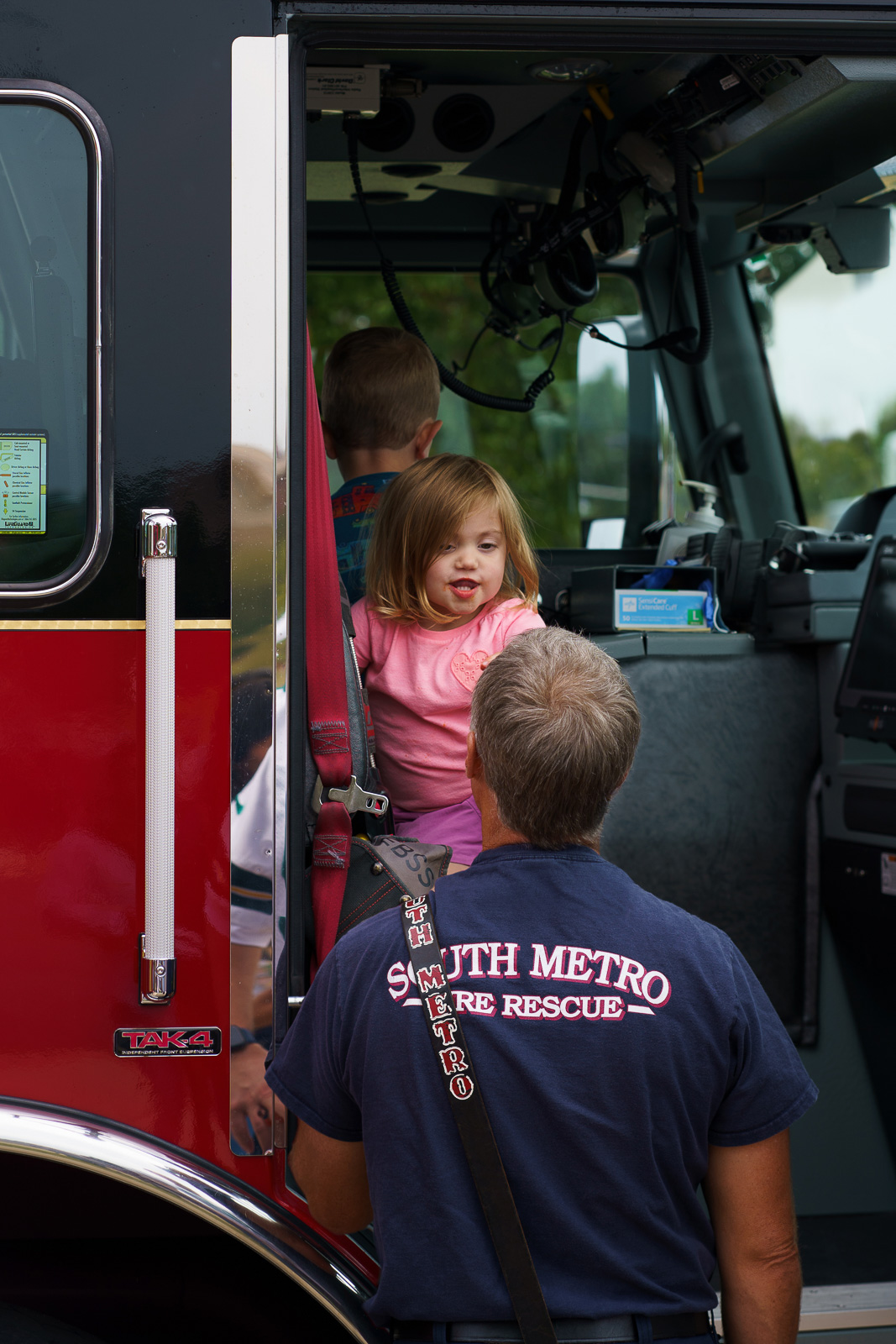 Fireman making a child laugh