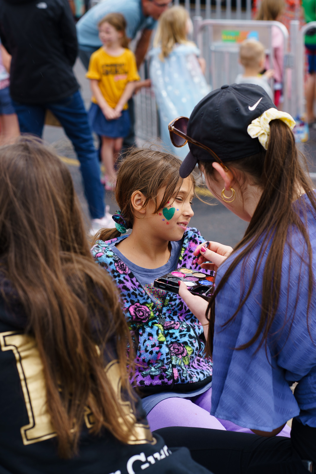Kid getting her face painted