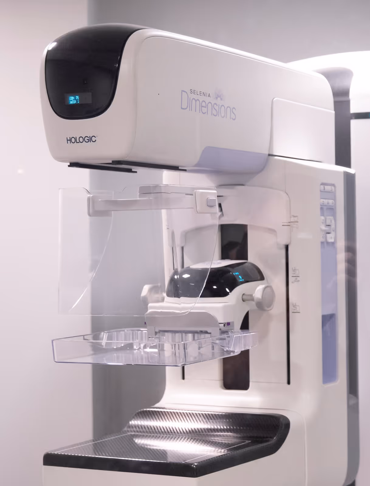 a mammogram machine in a modern Lincoln, Nebraska exam room, highlighting empathy, advanced equipment, and a comfortable, welcoming medical environment