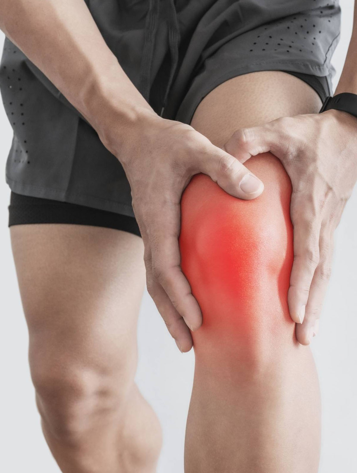 A person holding their knee, with the joint highlighted in red to indicate pain.