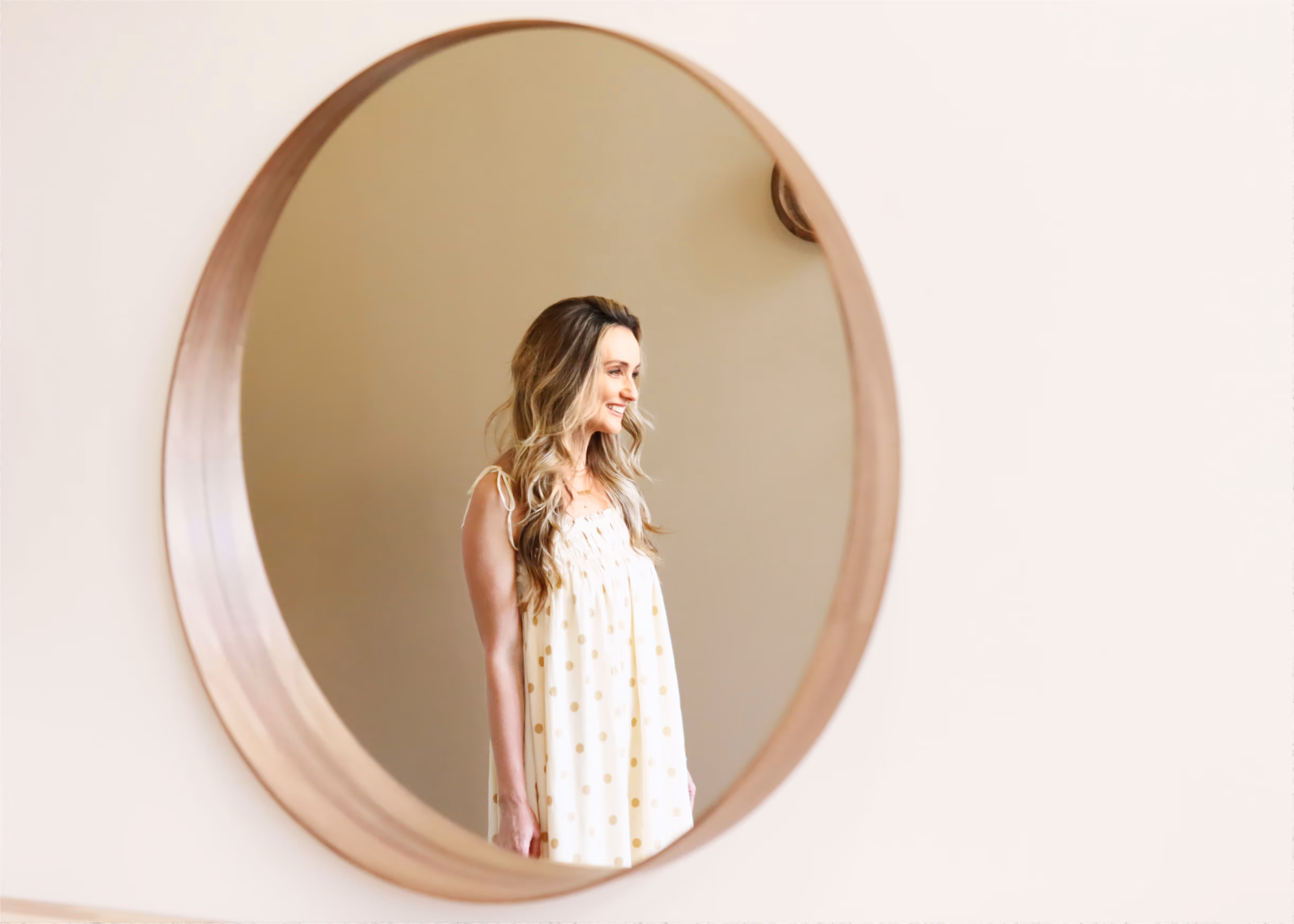 A reflection of Bobbi Smith in her salon mirror.