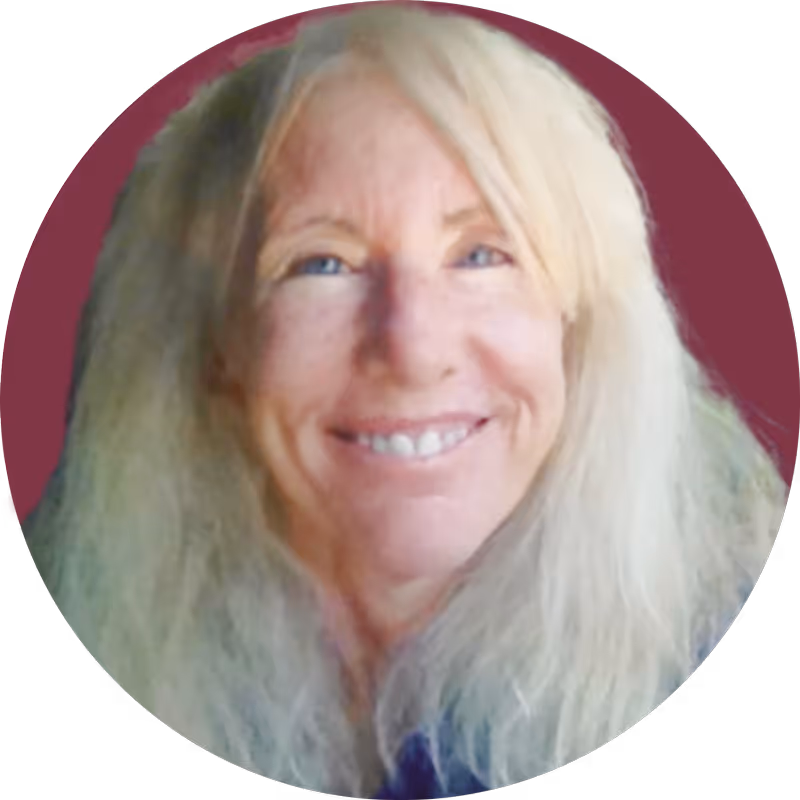 Smiling woman with long blonde hair against a dark maroon circular background.