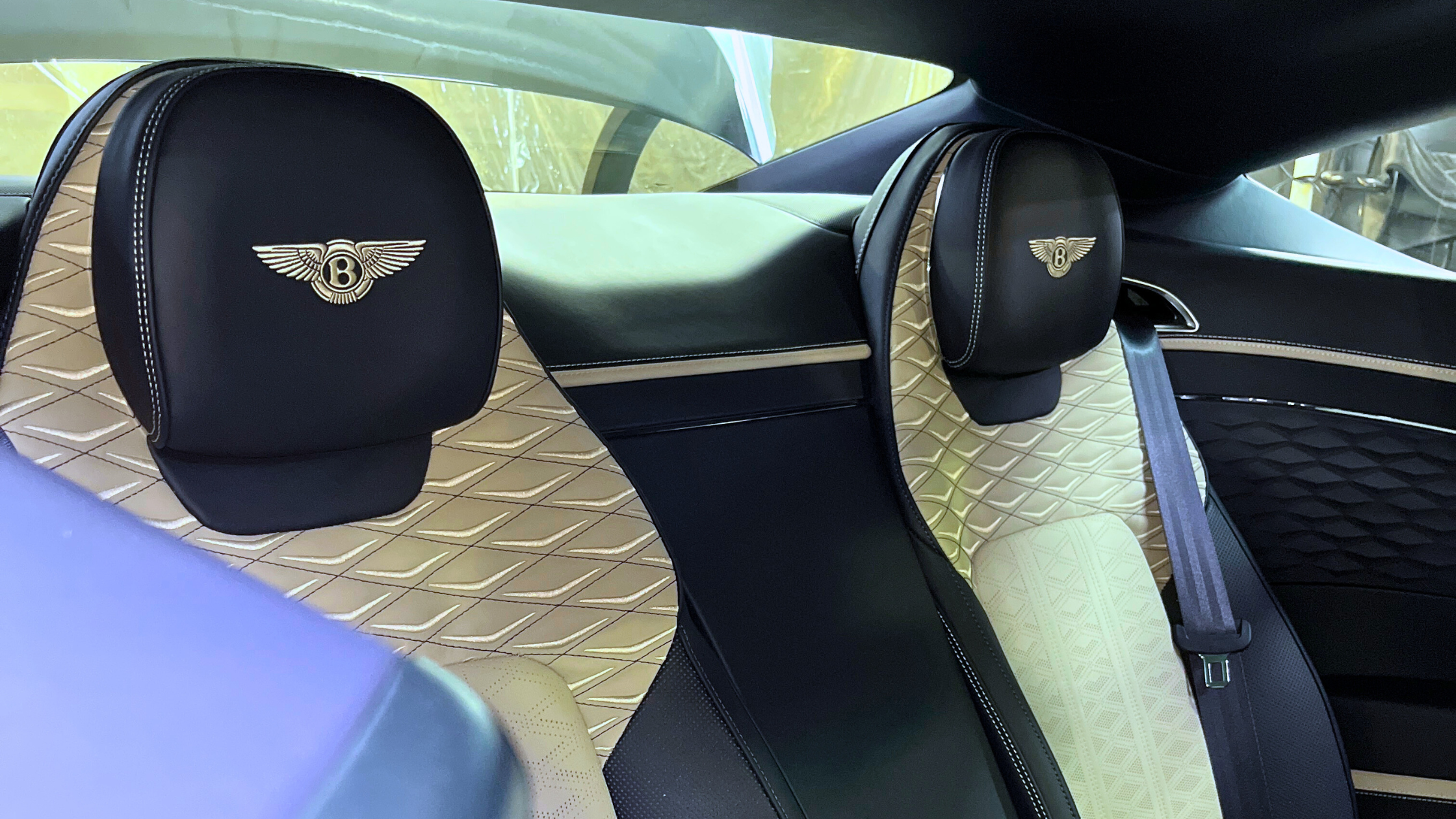 Luxury car interior seats after interior detailing, showing clean leather surfaces and refined finish following professional car wash interior care.
