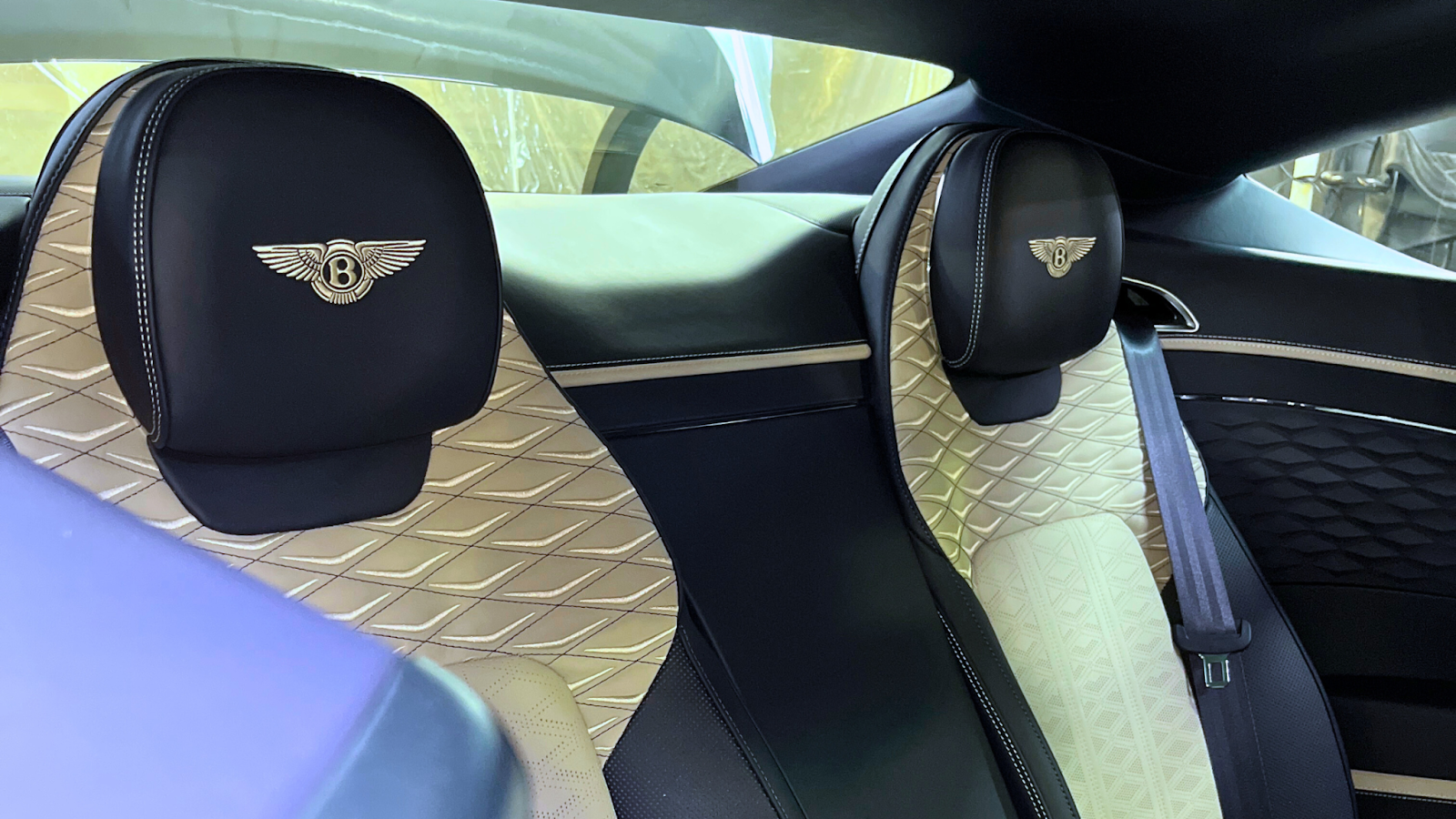 Luxury car interior seats after interior detailing, showing clean leather surfaces and refined finish following professional car wash interior care.