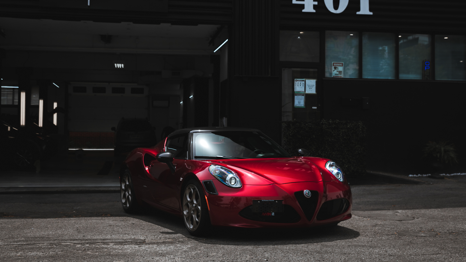 Red luxury sports car parked outside after professional car cleaning Toronto service, showcasing a polished exterior ready for a Valentine’s Day Toronto night out.