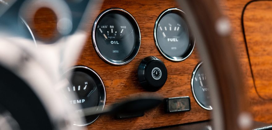 Close up of a classic car dashboard and gauges professionally cleaned by ALPHASHINE auto detailing in Toronto, highlighting precise interior car cleaning near me with refined craftsmanship.