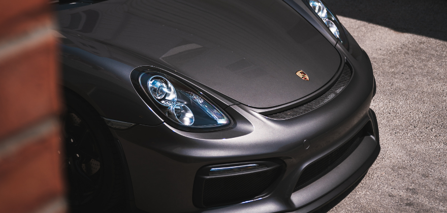 Matte grey Porsche exterior freshly detailed by ALPHASHINE car detailing Toronto, showcasing premium auto detailing near me with a smooth and flawless finish.