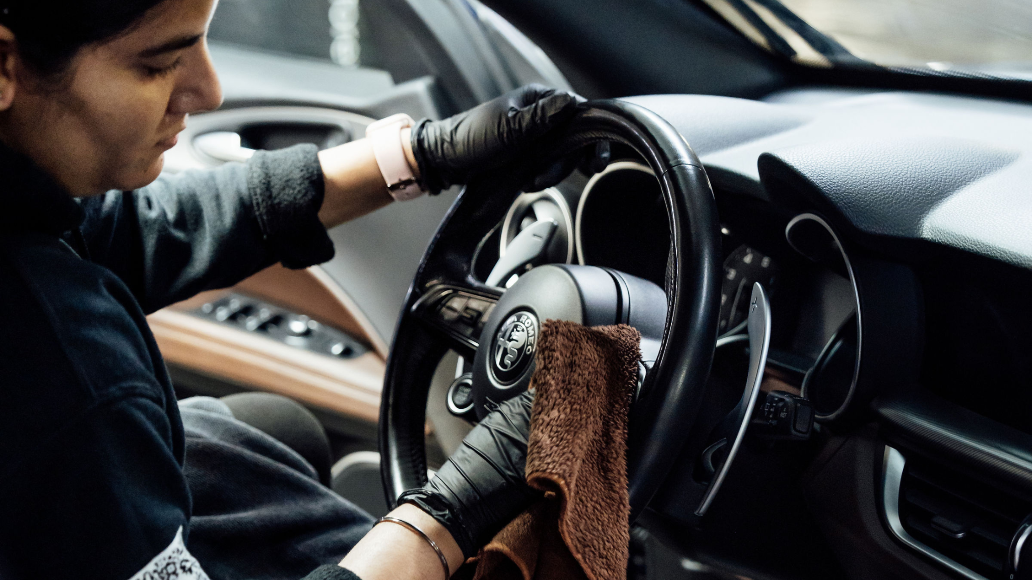 Interior detailing with microfiber cleaning steering wheel at ALPHASHINE Toronto, professional car detailing service