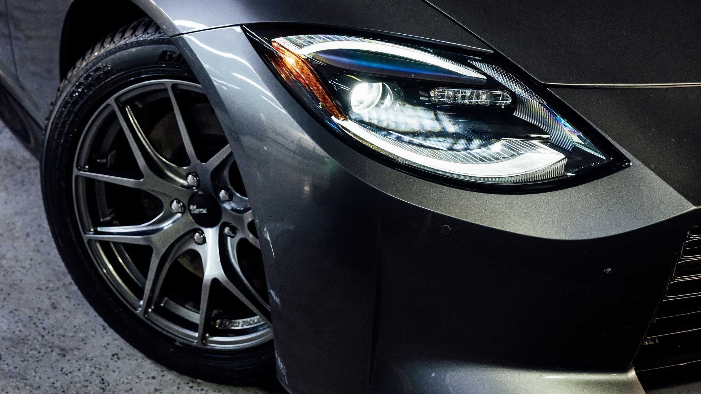 Close up of headlight and wheel after detailing at ALPHASHINE, exterior car detailing service in Toronto