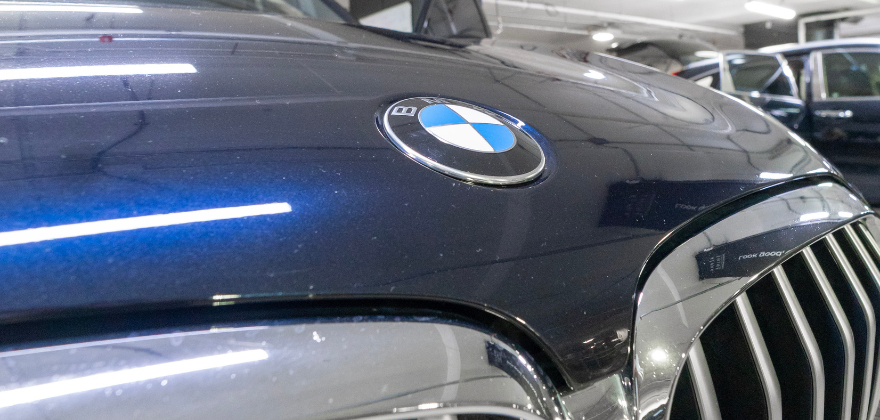 Dusty BMW hood and grille before premium service from ALPHASHINE Car Detailing in City Place, Toronto.