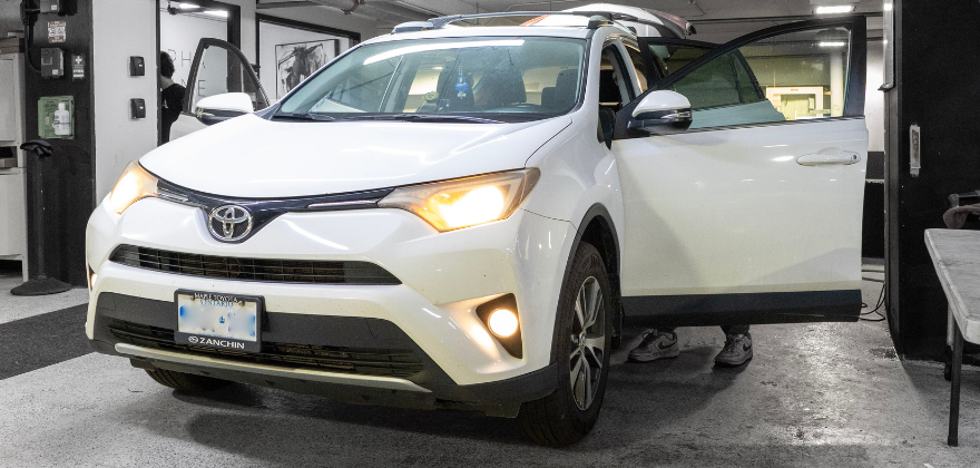 White Toyota SUV receiving professional car detailing from ALPHASHINE in Regent Park, Toronto.