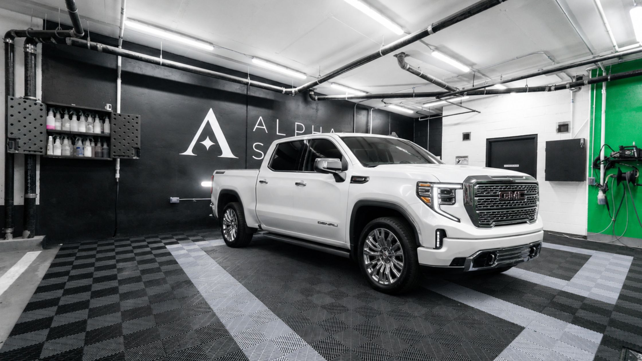 A white pick up truck parked in ALPHASHINE King West car detailing facility