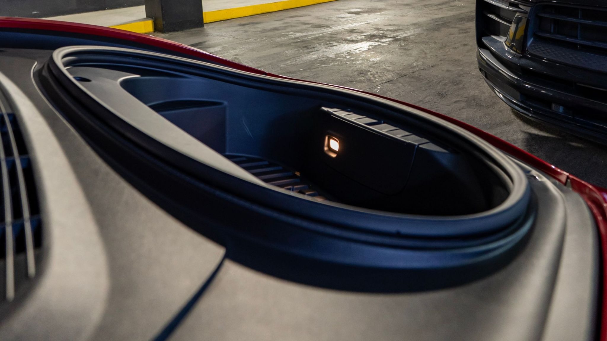 An electric car trunk cleaned by ALPHASHINE car detailing, operating in downtown Toronto with 3 locations. 