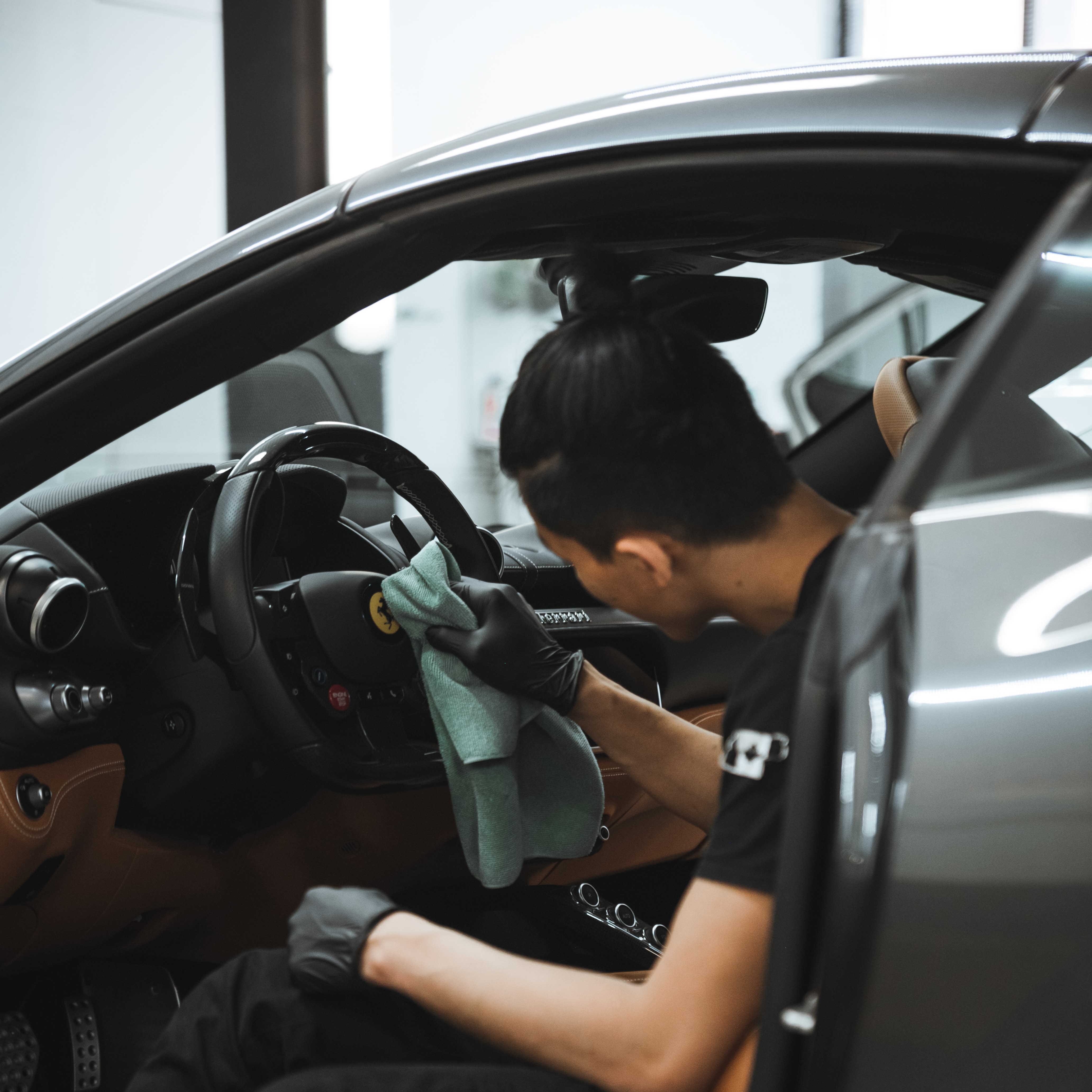 alphashine employee cleaning interior car steering wheel