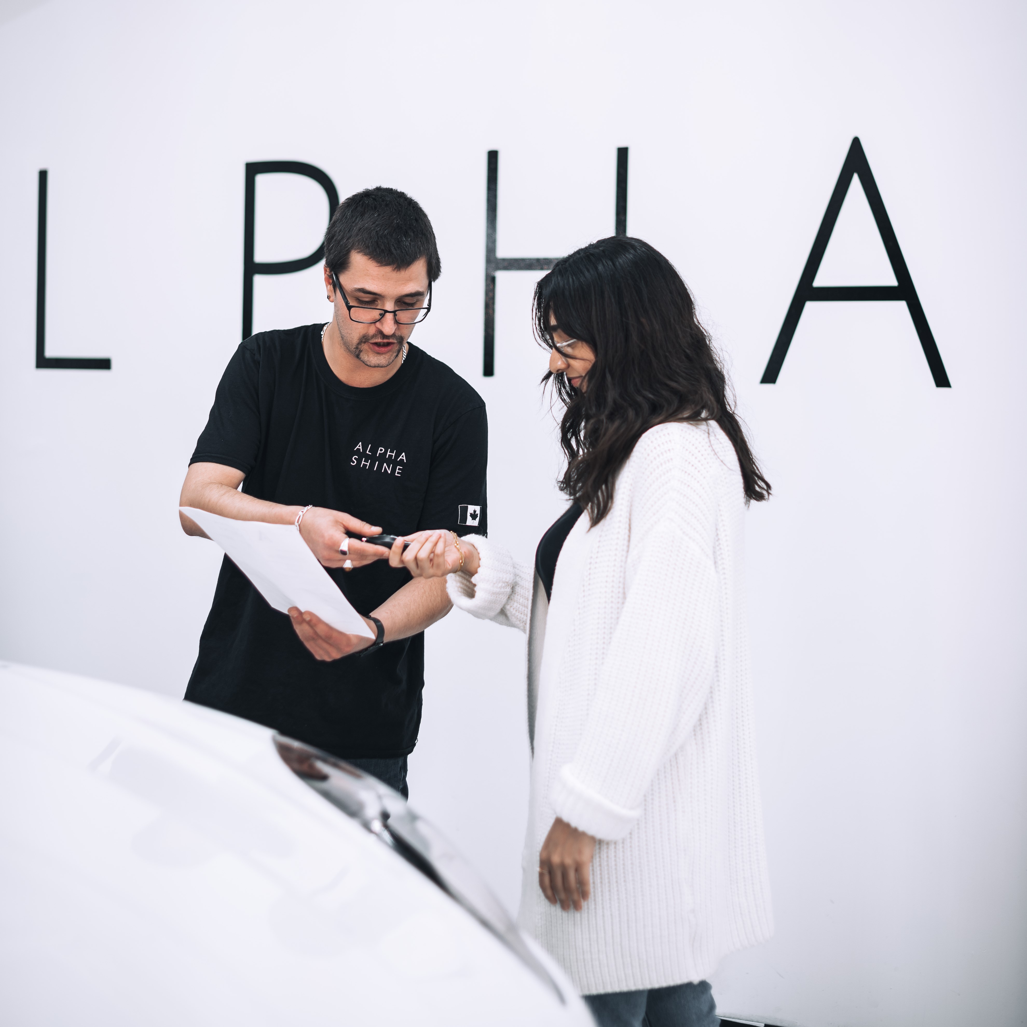 customer interacting with alphashine employee