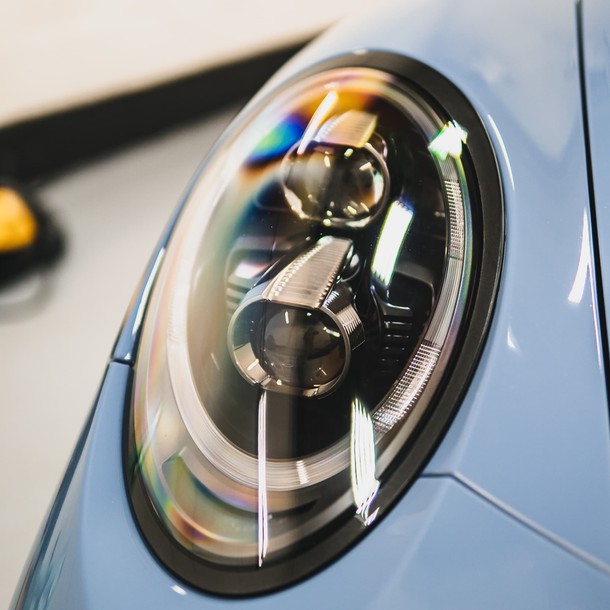 Headlight restoration done by Alphashine on a red car.