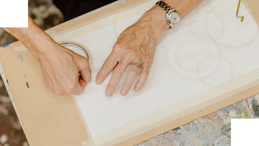 a pair of hands on a toilet